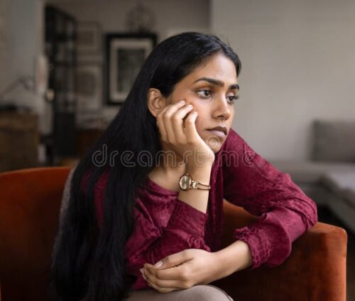 bored-frustrated-young-indian-woman-sitting-armchair-home-leaning-chin-hand-looking-away-staring-vacancy-suffering-431657370 bored-frustrated-young-indian-woman-sitting-armchair-home-leaning-chin-hand-looking-away-staring-vacancy-suffering-431657370
